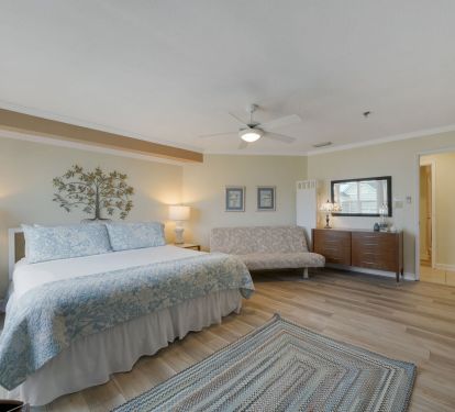 Spacious master bedroom with king bed and full size futon at the Cabana Club penthouse beachfront condo