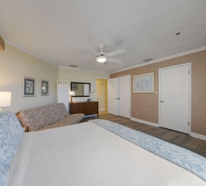 Coastal-inspired primary suite with ensuite bath in Destin vacation rental