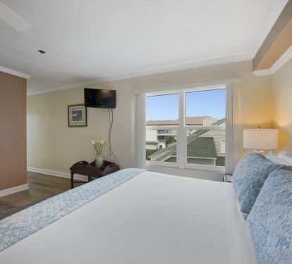 Rest and recharge after a day on the beach in this inviting master bedroom.