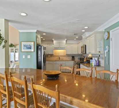Updated Destin vacation rental kitchen with full appliances and open living layout.