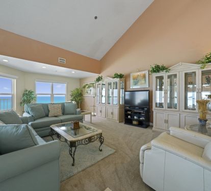 Airy beachfront retreat living room with spacious layout and comfortable seating for groups.