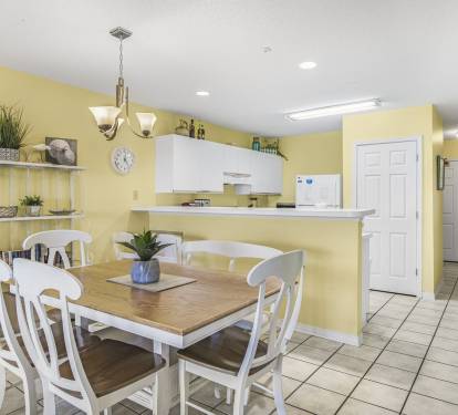 Plenty of space for meals, game nights, or reconnecting after a day in the sun - right off the kitchen.