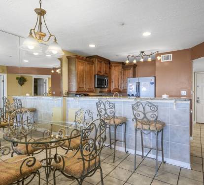 Ornate Dining Set Seats 4 with Additional Seating at the Kitchen Counter