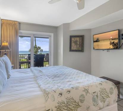 King Size Master Bedroom Opens to Patio with Beautiful Ocean View