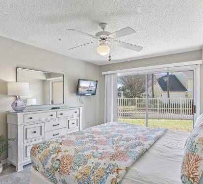 'The Master Bedroom Boasts cheerful Decor, Complete with a King-sized Bed.'