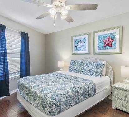 'Guest Bedroom Beautifully Decorated with a Queen-Size Bed'