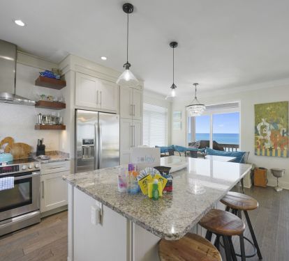 Full kitchen with 3 barstools