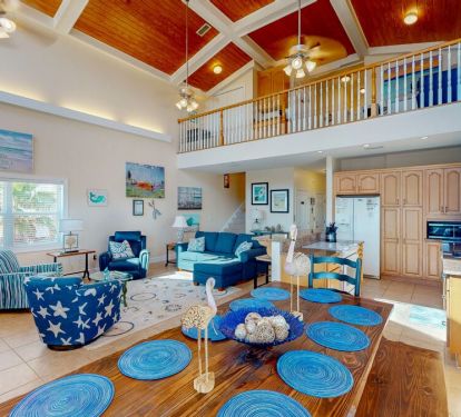 Throughout the home, charming and thoughtful decor add to its artfully crafted coastal vibe.