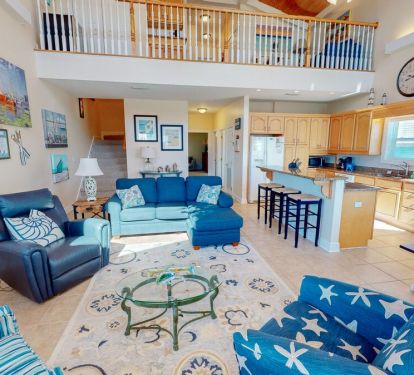 The simple, tasteful decor highlights seaside charm throughout the home.