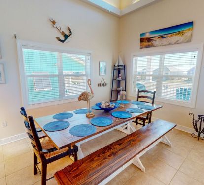 The large, stately dining table comfortably seats 10.