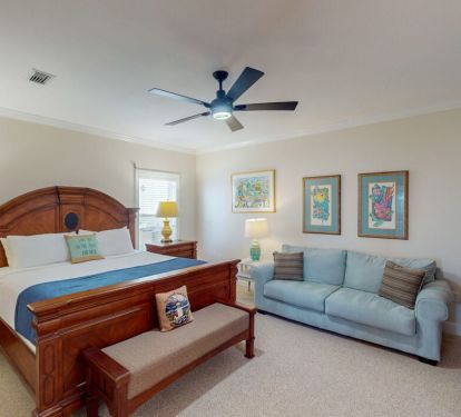 The elegantly appointed King Suite features a plush king size bed and comfortable sofa.