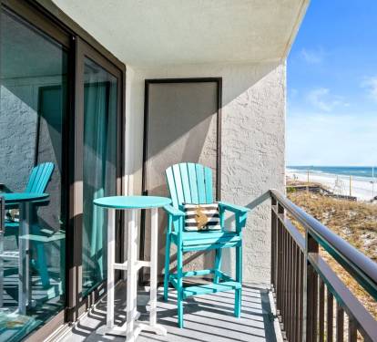 Relax and unwind in a lounge chair on the balcony overlooking the ocean