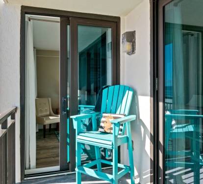 Step out onto the private balcony for a peaceful moment by the sea