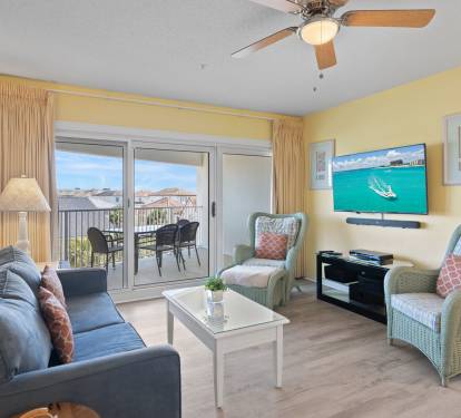 This airy living space opens straight to the balcony for effortless indoor-outdoor living.