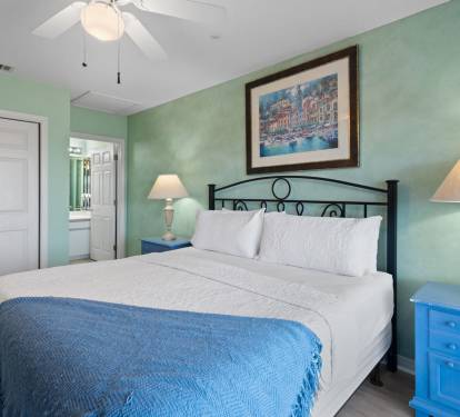 Drift off to sleep in this spacious bedroom with soothing tones and crisp coastal linens.