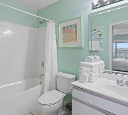 Clean, bright, and stocked with fresh towels - connects directly to the master bedroom.