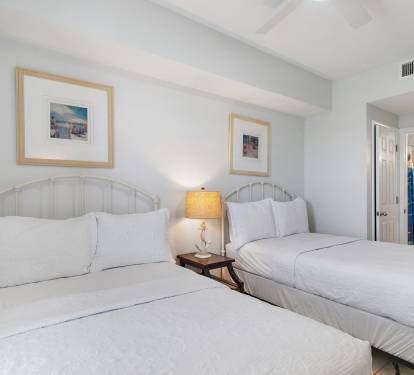 Guest Bedroom Features Two Queen Beds and Adjoining Bath