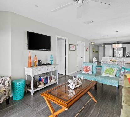 Bright and colorful living space with coastal d-cor and plenty of seating