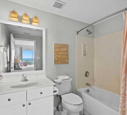 Private master bathroom with a full shower/tub combo.