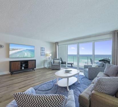 Perfect for relaxing after a beach day, the living room offers comfortable seating and front row views of the Emerald Coast.