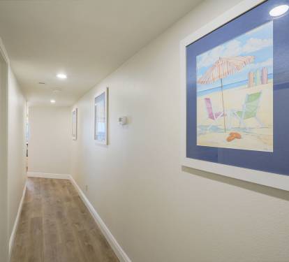 Bright entry way with clean lines and coastal art welcomes you to Cabana Club 307