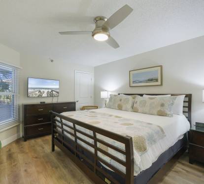 Rest and recharge after a day on the beach in this inviting master bedroom.
