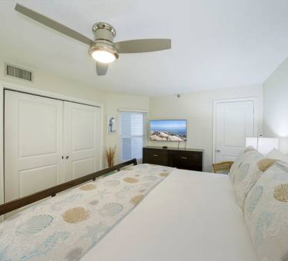 Beachfront condo master bedroom with private bathroom access
