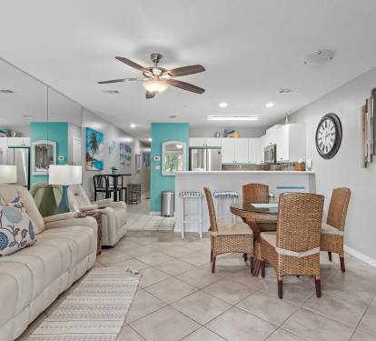 Open living and dining space with tile floors and natural light at Maravilla 4205.