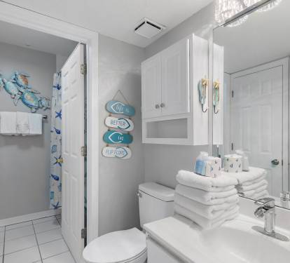 Full bathroom with shower, vanity, and coastal d-cor at Maravilla 4205, a Miramar Beach condo rental.