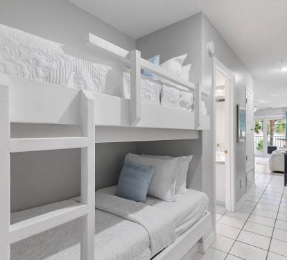 Hallway bunk beds perfect for kids at Maravilla 4205, a Miramar Beach vacation rental near the Gulf.