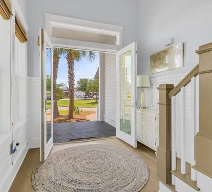 Sleeps 14, includes golf cart, bright modern entry sets the tone for connected coastal living at Prominence South.