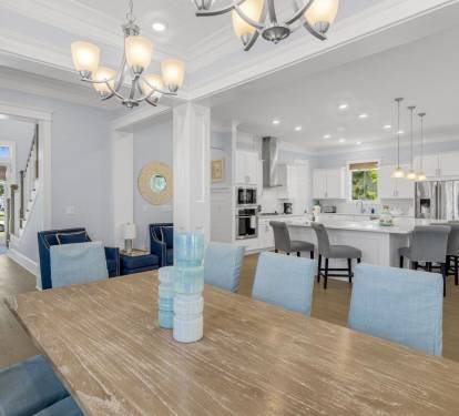Dining and living flow seamlessly. Nothing blocked off. Energy moves through the space. This is how vacation houses should actually work.