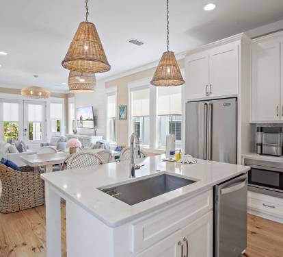 Spacious kitchen with island seating, updated appliances, and an open layout that connects seamlessly to the living area.