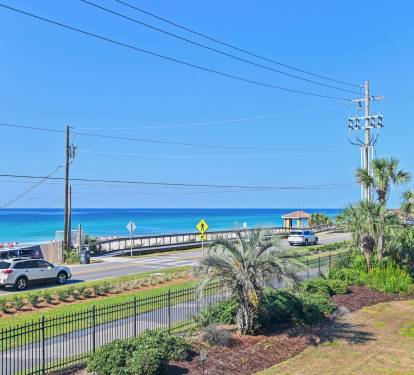 Balcony views that stretch to the emerald waters of the Gulf - just steps away.