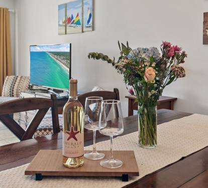 Plenty of room for the whole crew around this spacious dining table and cozy living room. Don-t miss out-secure your last-minute coastal retreat in Miramar Beach today!