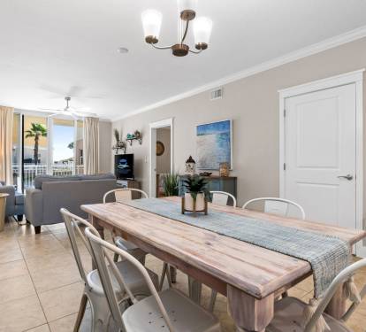 Spacious dining area with a table for six, open to the living room and kitchen for easy gatherings.