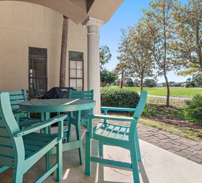 Relax on the shaded patio at License to Chill in Sandestin-s Villa Lago - perfect for families, golfers, and beach lovers.