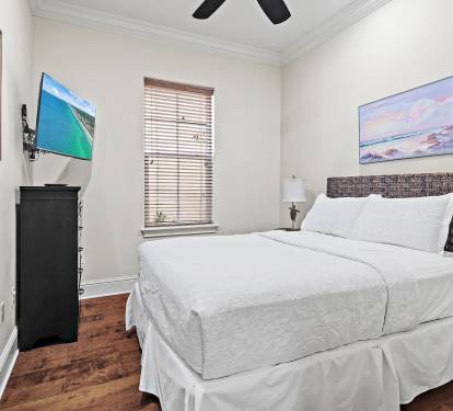Relax in comfort with a king bed and serene coastal d-cor steps from the main living area.