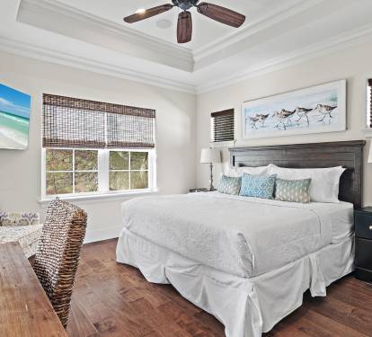 Spacious king suite with natural light, serene views, and private bath access.