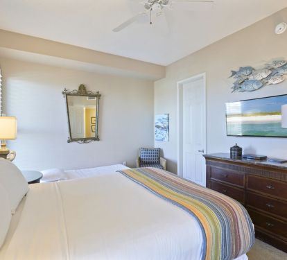 Coastal queen bedroom in Cabana Club 205 with beach d-cor, and room for a twin roll-away.