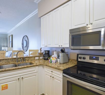 Spacious coastal kitchen with stainless appliances and ocean views
