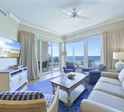 Elegant beachfront living space with floor-to-ceiling windows overlooking the Gulf.  Welcome to Crescent 411