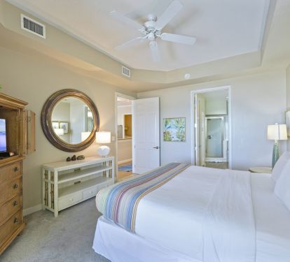 Destin condo master suite with Gulf views and TV armoire