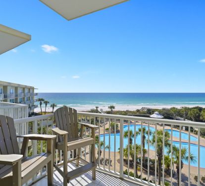 Elevated beachfront balcony with panoramic Destin ocean and pool views