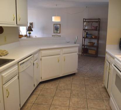 From back of the kitchen lookin gout towards the dining area.