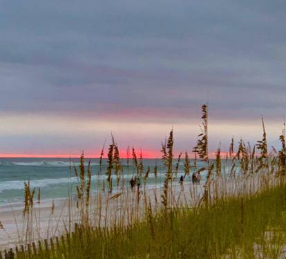 Beautiful Sunset at the Beach - This condo comes with Free Daily Beach Chairs/Umbrella Set Up”