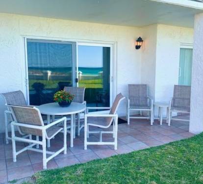 Lounge on your Patio Close to the Pool and Beach