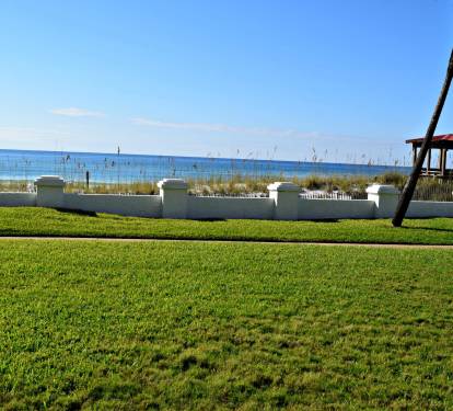 Actual view from the unit and the patio. Slip on your shades and stroll to the beach!
