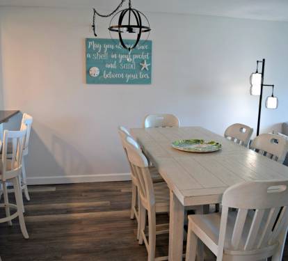 Low bar with three chairs, relax and keep the cook company!