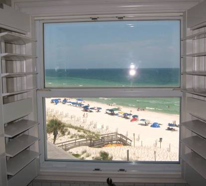 Can always open the Plantation shutters for an unobstructed Gulf view form this kitchen.